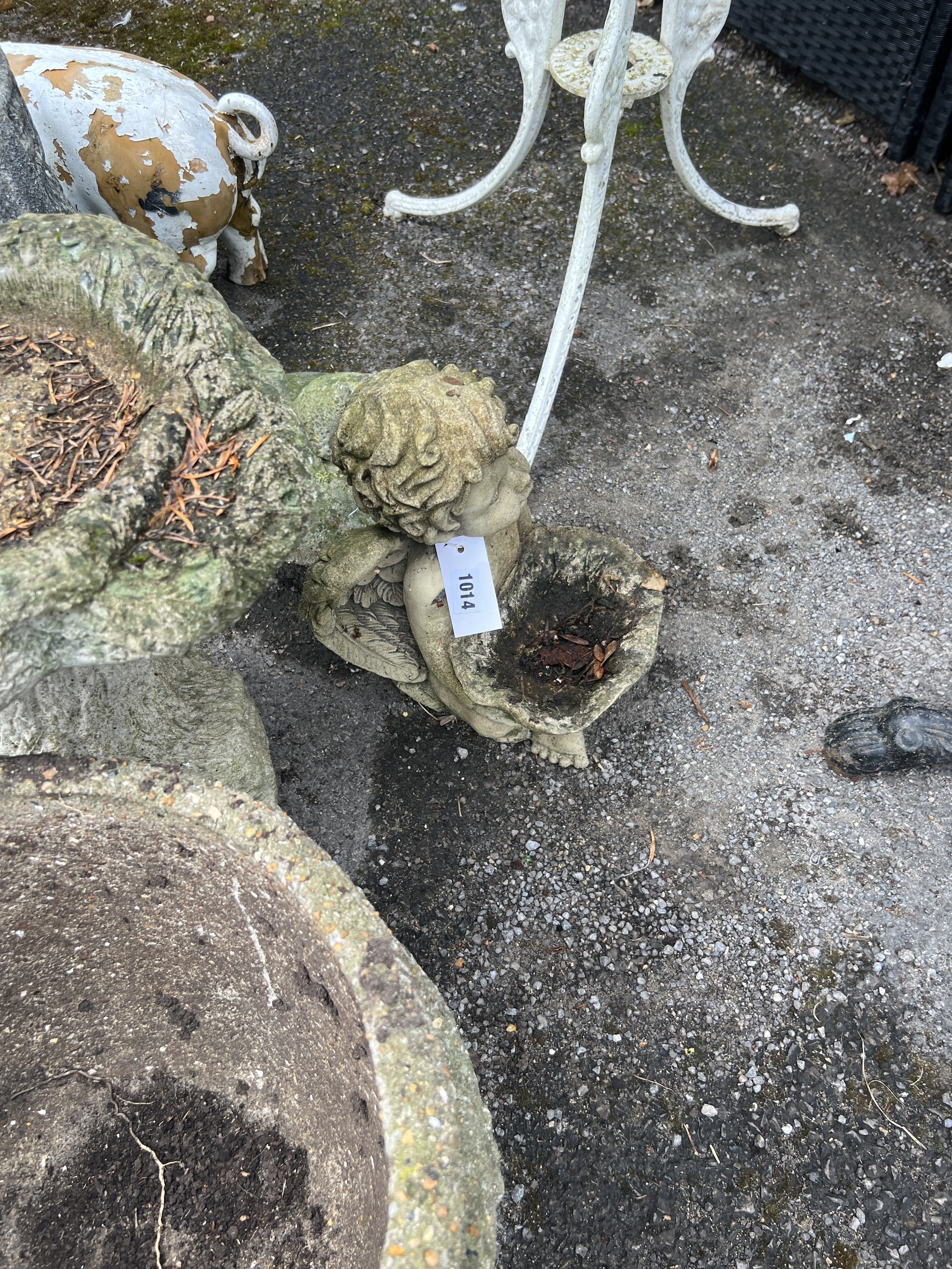 Two reconstituted stone garden planters, larger diameter 40cm, height 30cm, two bird baths and two ornaments